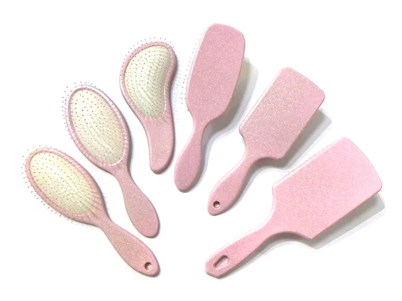 粉色塑料花式卷发梳