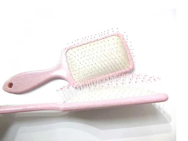 粉色塑料花式卷发梳